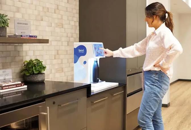 Water service alongside an office coffee and hydration station